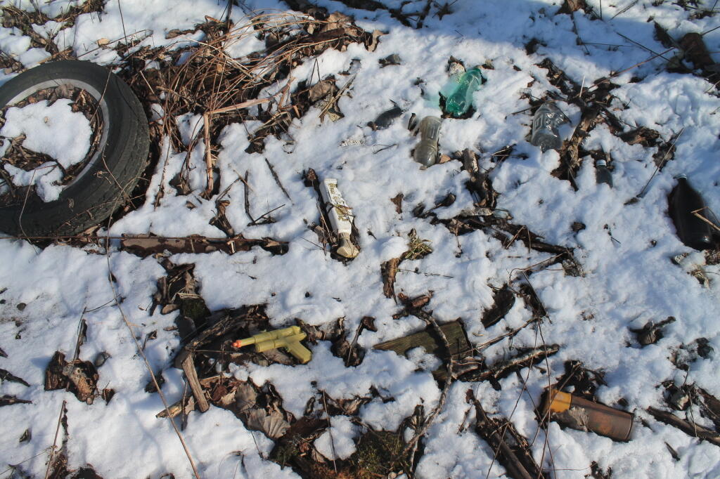 Photo: A Gun and Miscellaneous Debris Photo: A Gun and Miscellaneous Debris