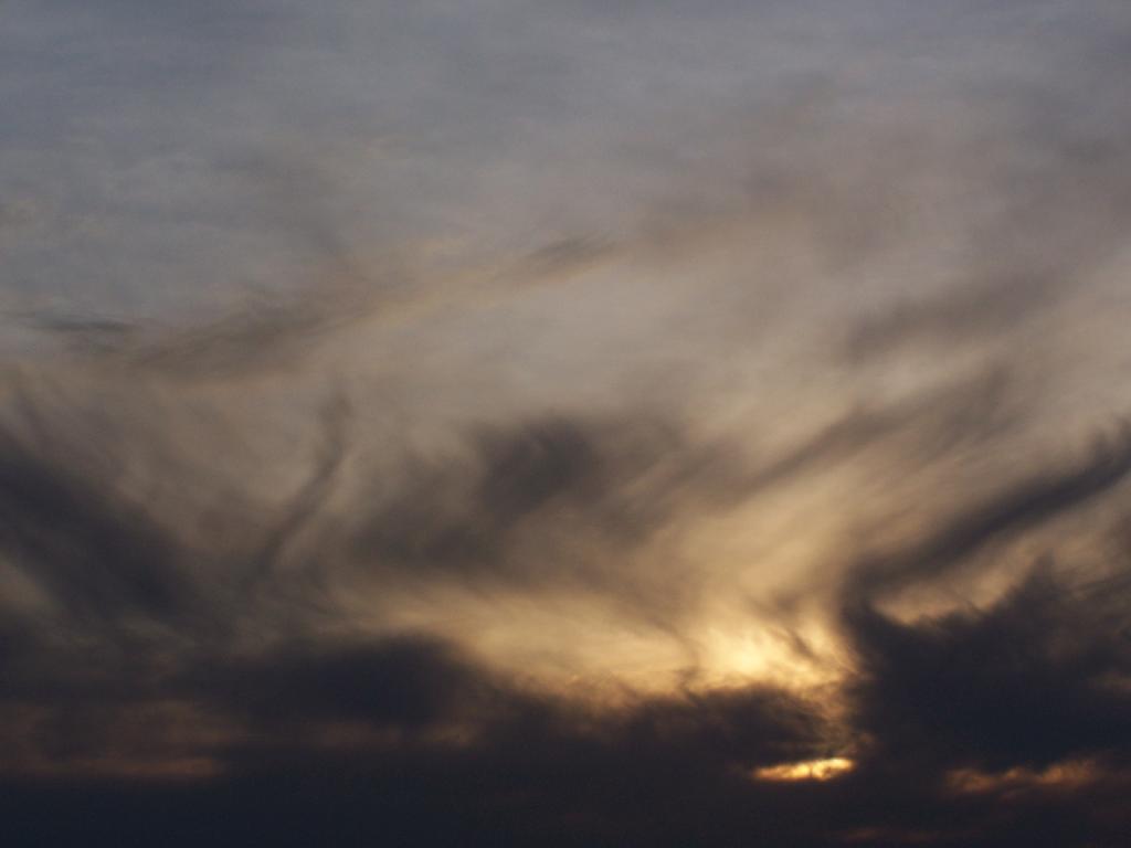 Photo: Setting Into a Bed of Clouds