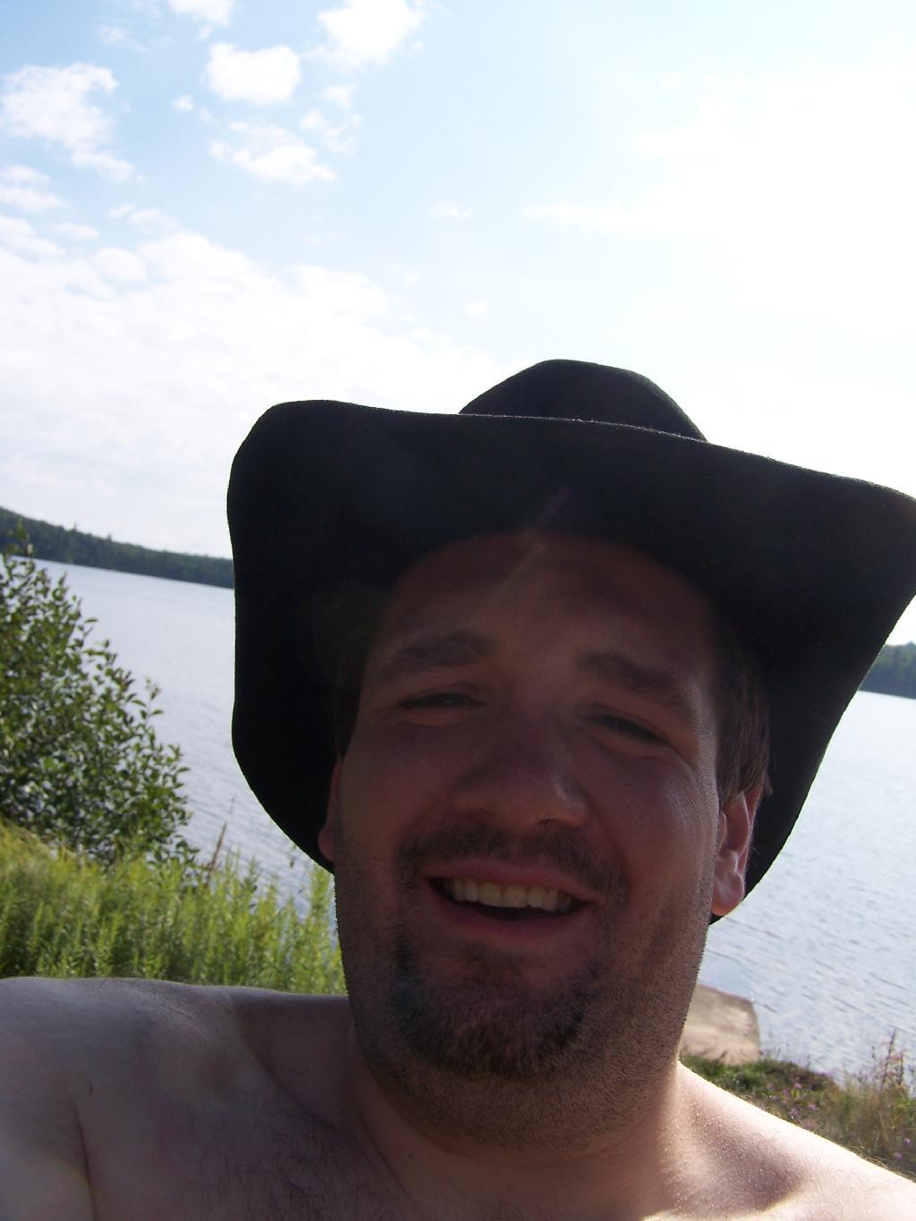 Photo: Cowboy Hat, Swimming Trunks, Work Boots.