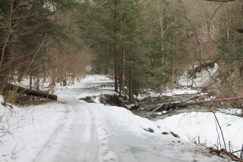 Photo: More Erosion Past Washed Out Bridge Photo: More Erosion Past Washed Out Bridge