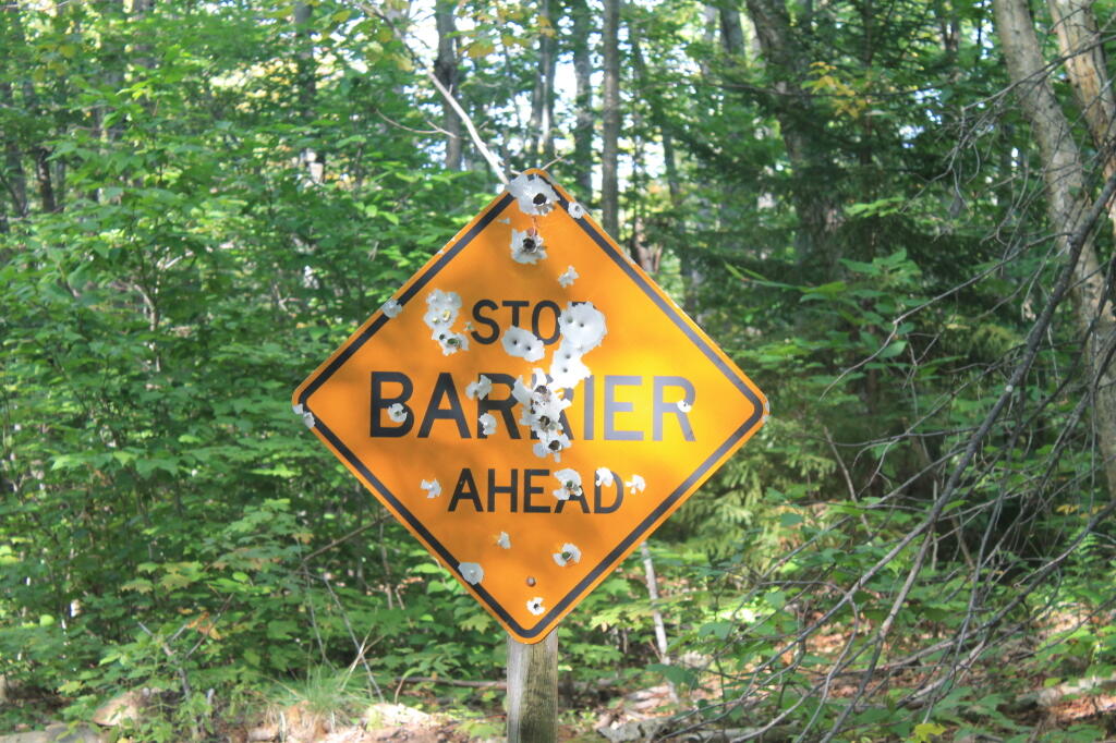 Photo: Well Shot Up Sign at New Squaw Lake Barrier