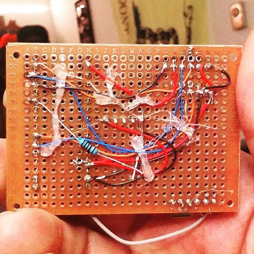 Photo: Backside of GPS Logger, Potted with Hot Glue to keep wires in place Photo: Backside of GPS Logger, Potted with Hot Glue to keep wires in place
