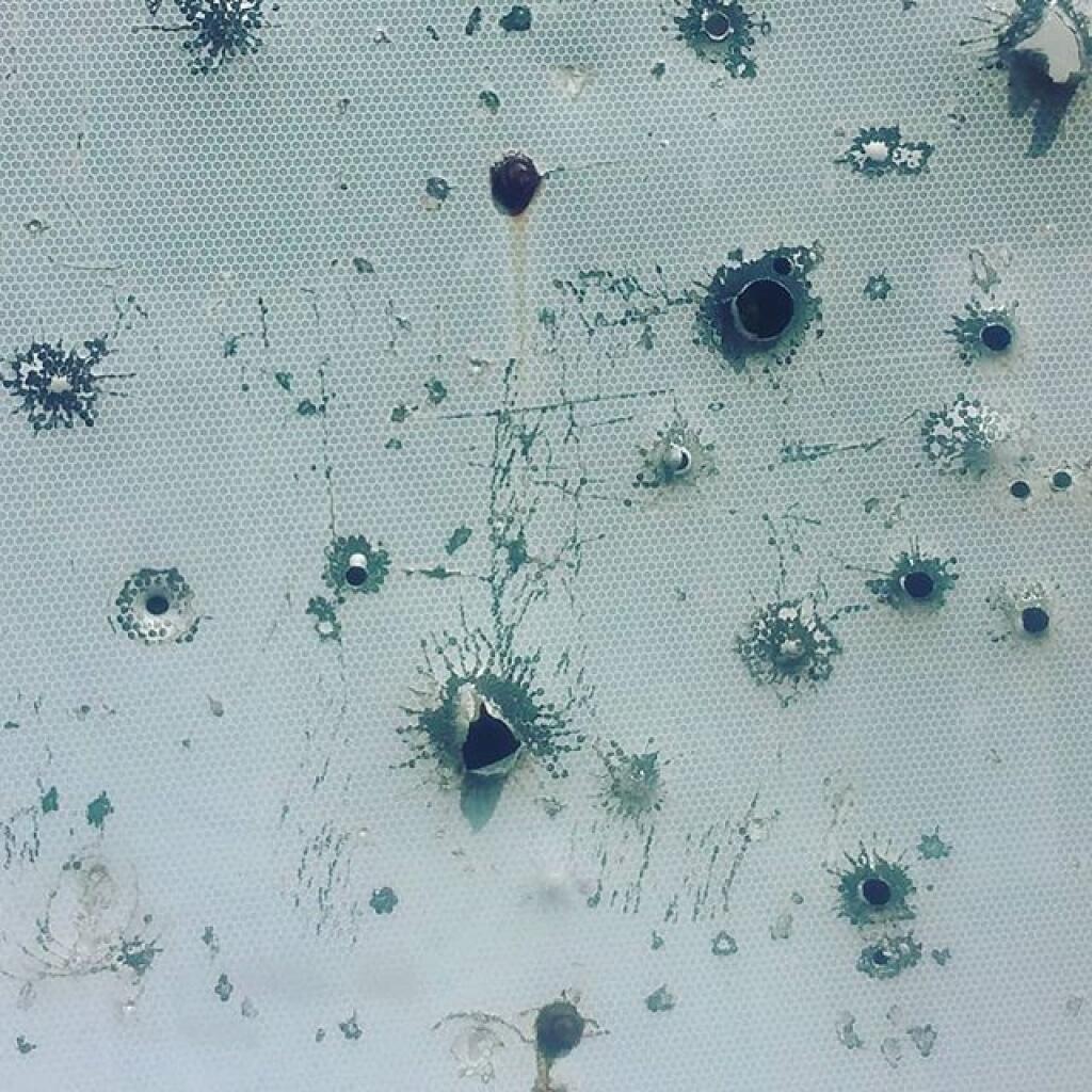Photo: Bullet holes in the old stop sign on the Beaver Lake Gate